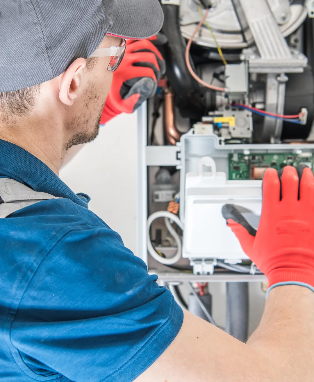Plain View Solutions technician servicing a furnace